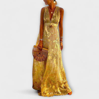 Vestit fluid amb escot en V i detalls de lluentons