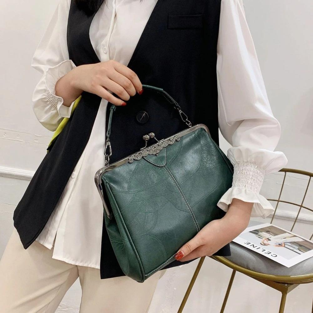 Mila - Bossa vintage atemporal amb elegant tancament de solapa